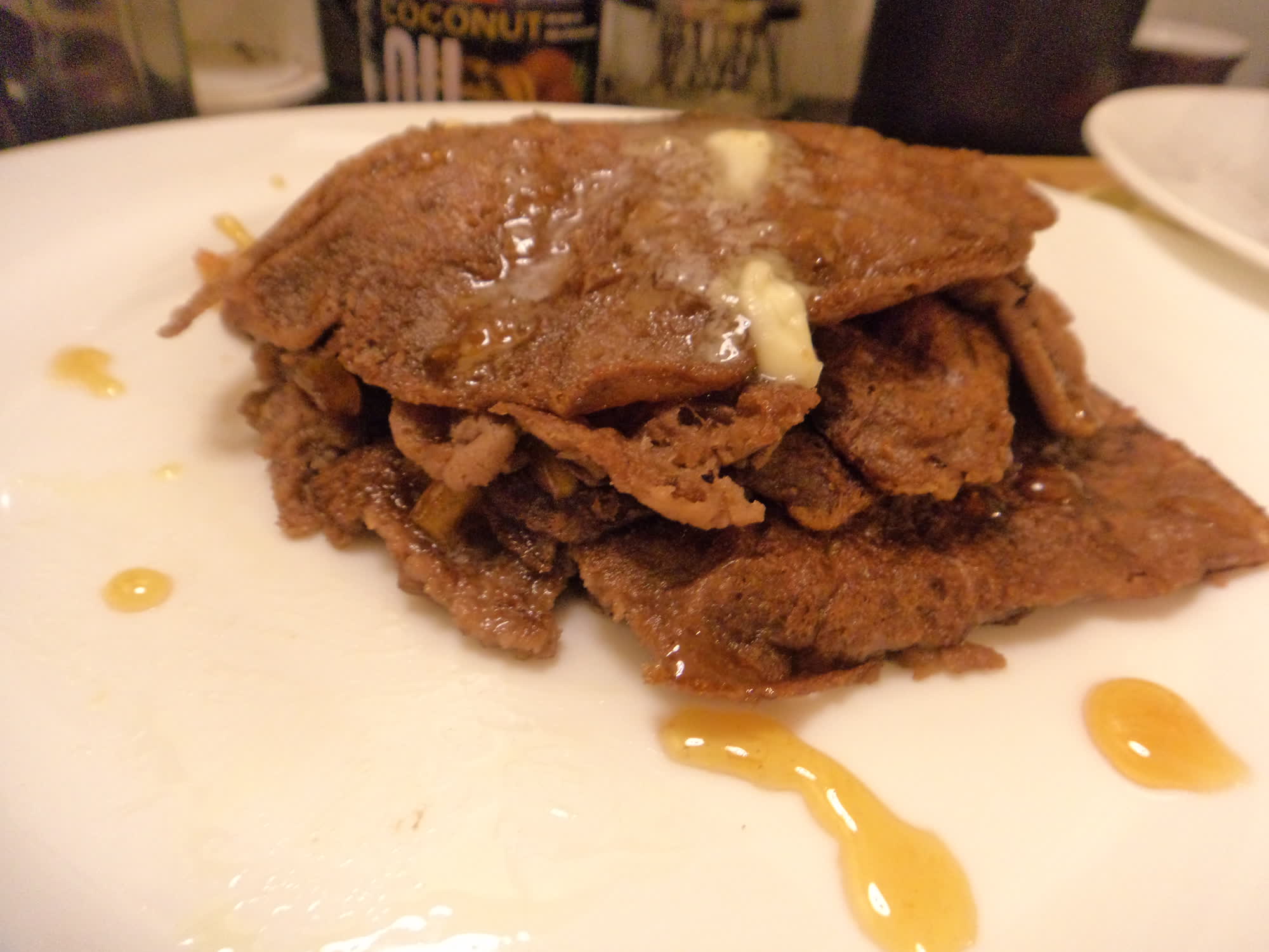 Chocolate flatcakes with butter and orange sauce.