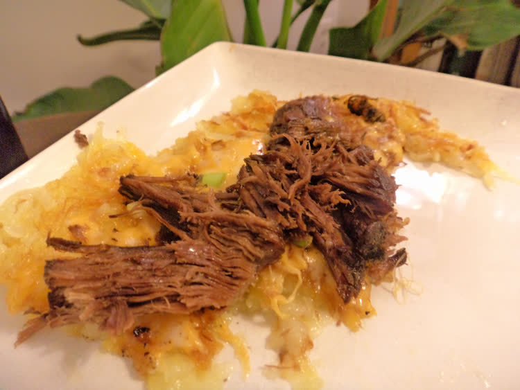 Brunch: Beef potroast strips on rosti with cheese and green onion.
