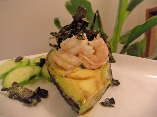  Shrimp in avocado with cucumber slices and seaweed on top